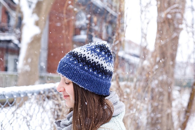 Side view of Matau, a colourwork knitted Beanie, Toque, Hat