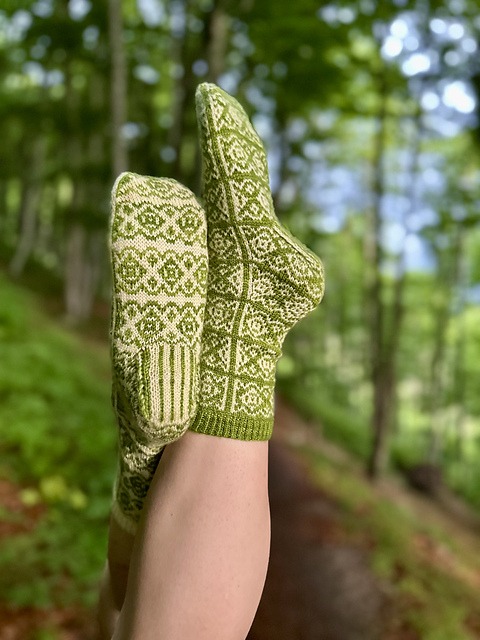 Side view of the Beech Bud Socks, a mid-calf colourwork sock knitting pattern