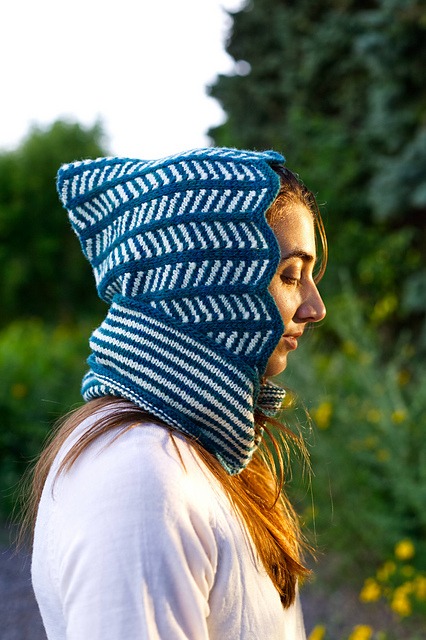 Closeup side view of Lollyzag, a knitted Balaclava/Hood with chevron stripes and a cowl