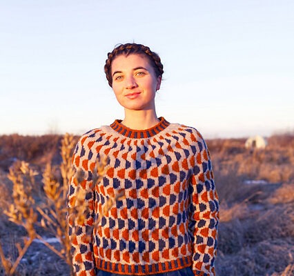 Front view of Wax & Wane, a round yoke colourwork pullover knit from the top down in three colours