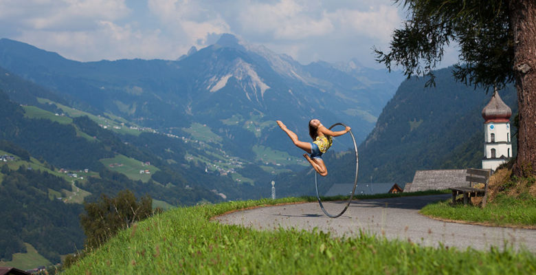 Cyr wheeling on a mountain road