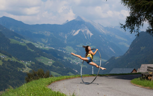 Cyr wheel split jump with mountains