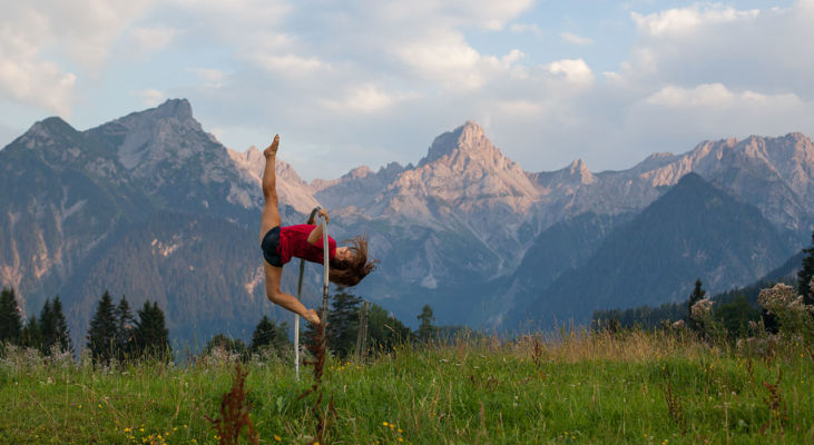 Cyr wheel pose in front of the Zimba mountain