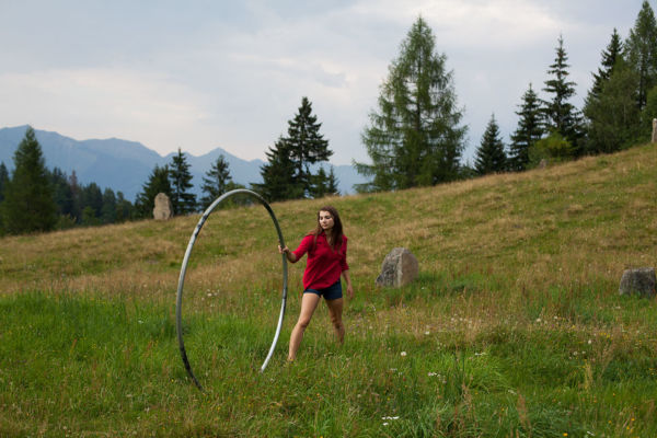 Catching Cyr Wheel in the meadow