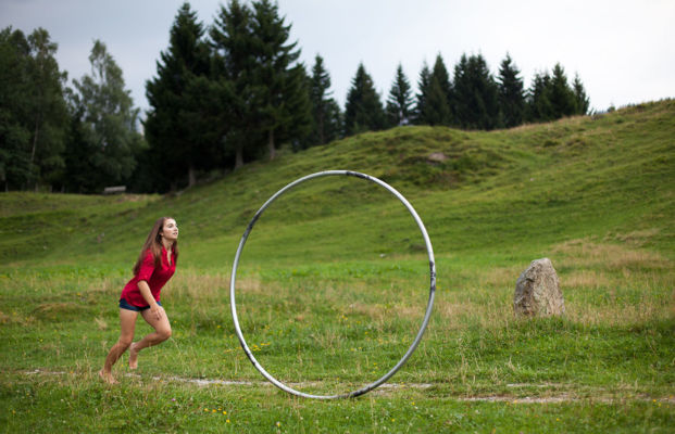 Chasing after my Cyr Wheel in a meadow