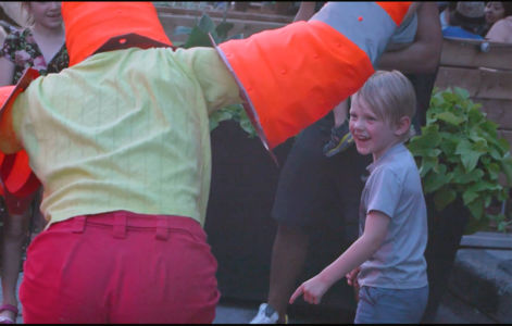 Traffic cone artist engages with boy